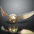 Harry Potter Golden Snitch with Shiny Gold Wings and Intricate Reflective Surface Design