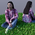 Woman Sitting On Green Grass With Tie Dye Sweater Blue Jeans And Front Back View