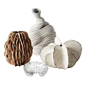 Elegant Handcrafted Decorative Sculptures With Textured Materials And Organic Shapes