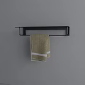 Hanging Beige Towel With White Stripes on Black Towel Rack Against Grey Background