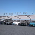 Various Cars Including Volkswagen BYD Hongqi Tesla NIO Xiaomi Parked Under Canopy