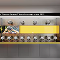 Modern Helmet Showroom With Curved Display Counters Yellow Pillars Wall Decorations And White Helmets
