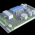 Modern Industrial Factory Site Featuring Blue Roof Building Storage Tanks And Green Spaces