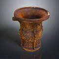 Intricately Carved Sculptural Vessel With Detailed Patterns And Decorative Handles