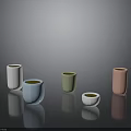 Five Colorful Cylindrical Vases On Black Smooth Surface With Gray Gradient Background