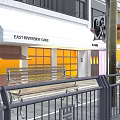 East Riverside Cafe Storefront With White Awning Yellow Windows And Street Cyclist Scene