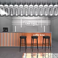 LAB Cafe Front Counter With Coffee Machine Black Bar Stools And Row Of Lights