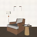 Modern Single Sofa With Light Colored Wall Wooden Floor Floor Lamp And Small Round Table