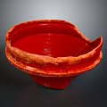 Red Hand Carved Ceramic Bowl Sculpture With Textured Surface And Vibrant Red Color