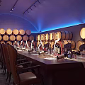 Elegant Wine Cellar Interior With Wooden Barrels Long Table And Wine Glasses