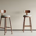 Two Modern Minimalist Bar Stools With Wooden Frame And Light Gray Upholstered Seats