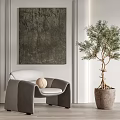 Modern Velvet Leisure Chair With White Cushion Gray Frame And Olive Tree In Interior