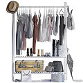 Different Colored Clothes Hanging On Rack With Coats Shirts Boots Suitcase Bags And Umbrella