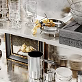 Elegant Kitchenware Display On Shelves With Plates Glasses Kettle And Framed Art