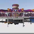 Vibrant Amusement Ride With Spinning Arms Passenger Seats Staircase And Safety Railing