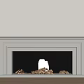 White Framed Fireplace With Burning Fire And Wood Logs Against Light Wall On Wooden Floor
