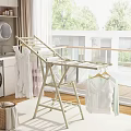 Modern Foldable Clothes Drying Rack With White Clothes On Balcony Home Use