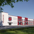 Modern Red and White School Building Exterior With Large Windows Green Lawn and Trees