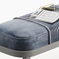 Navy Blue Velvet Ottoman Bench With Vertical Tufted Gray Legs and Cozy Blanket on Top