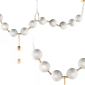 Modern Chandelier With White Spherical Shades And Golden Metal Frame For Elegant Contemporary Home Decor