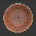 Carved Orange Decorative Dish With Intricate Edge Patterns And Small Base Stand
