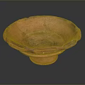 Red Bowl Shaped Sculpture With Irregular Edges And Textured Surface On Base