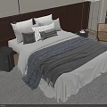 Stylish Double Bed With Dark Wooden Headboard Plush Pillows And Grey Throw Blanket