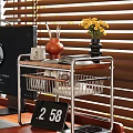 Modern Metal Storage Rack With Wooden Shelf Black Vase Yellow Flowers Books And Ceramic Jar