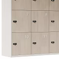 Light Wood Lockers With Numbered Doors Arranged In Multiple Rows