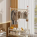 Stylish Clothes Hanging on Metal Rack with Neutral Tones and Accessories