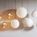Multiple Modern Hanging Lit Chandeliers Round Transparent White Shapes Minimalist Interior