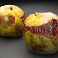 Natural Fresh Coconuts With Green And Brown Husks And Open Tops