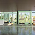 Modern Clothing Store Interior With Glass Display Windows Dresses And Polished Floor