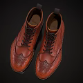 Stylish Orange Leather Brogue Boots With Black Laces And Intricate Patterns