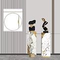 Two Modern Sculptures On Marble Pedestals With Gold Accents In Contemporary Interior Space