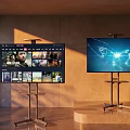 Two Modern Televisions Displaying Streaming Content And Data Visualization On Stands Warm Lit Interior
