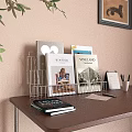 Books And Magazines Organized In Wire Rack On Wooden Desk With Calendar Pens And Papers