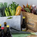 Assorted Fresh Foods And Beverages With Paper Bags