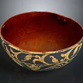 Intricately Carved Bowl With Golden Floral Patterns And Rich Red Interior