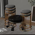 Black Circular Spiral Seat Stool With Silver Metal Legs And Wheels In Living Room