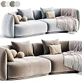 Modern Two Seater Sofa In Light Blue And Beige With Soft Pillows And Cozy Blanket