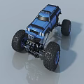 Blue Toy Monster Truck With Large Tires And Black Chassis On Gray Surface
