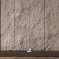 Light Colored Stone Wall With Natural Textured Surface And Small Decor Item 3d model