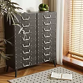 Black Storage Cabinet With Multiple Drawers White Handles In Room With Wooden Floor And Plant