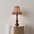 Classic Brown Wooden Table Lamp With Beige Fabric Shade On Round Metal Table