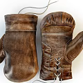 Brown Leather Boxing Gloves with Stitching and Lace-up Design for Sports Training