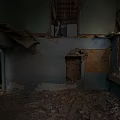 Abandoned Detached House Interior With Damaged Walls And Debris On Floor
