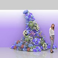 Commercial Large Floral Display Equipment With Various Colored Flowers And Woman Standing By
