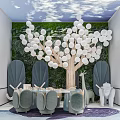 Indoor Kids Activity Space With Green Plant Wall White Balloon Tree Blue Chairs And Toys