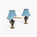 Two Elegant Table Lamps With Light Blue Shades And Ornate Brass Bases